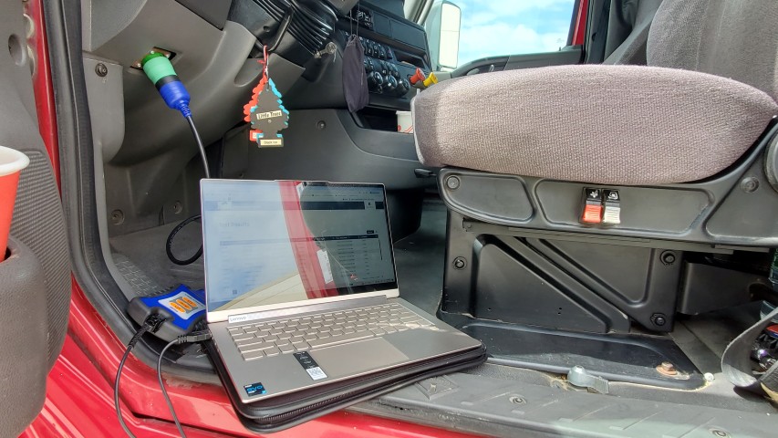 semi tractor diesel emissions test in progress using OBD connector in San Diego 